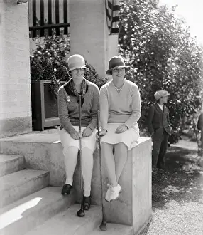 Stylish Prints: Two female golf players on porch, 1928