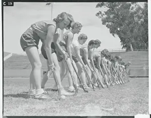 Prints of (Original Caption). Whittier, California: Fair Club Wielders Frozen Moments: A Journey Through Hockey History: Female Hockey Teammates Practicing Position on Field