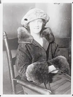 Female Juror Posing in Coat and Hat