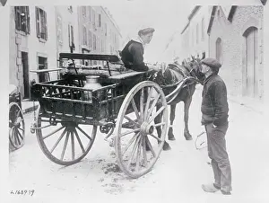 Female Milk Man Chatting with Pedestrian