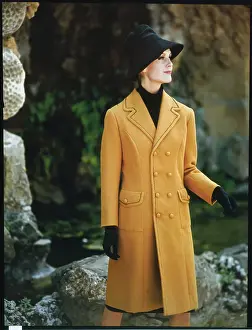 Female Model Posing in Yellow Coat