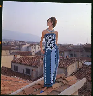 Female Model Wearing Blue Dress and Posing on Rooftop