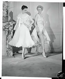 Two Female Models Wearing Frilly Undergarments