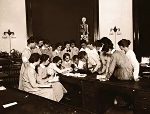 Female nursing students watching blood pressure demonstration (B&W)