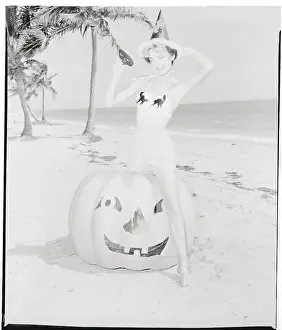 Halloween Prints: Female Sitting Atop Halloween Pumpkin