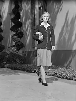 Schoolgirl Prints: Female student walking outside school, portrait