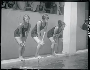 Female Swimmers Preparing to Dive into the Pool