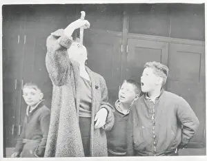 Female Sword Swallower During Act