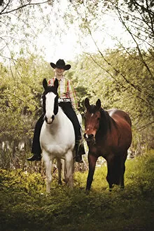 Images Dated 19th April 2014: Female western rider on a Paint Horse, Black Tobiano colour pattern