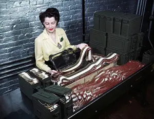Inspection Prints: Female Worker Inspects Gun Bullets