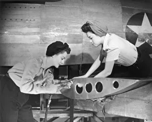 Female workers working on plane