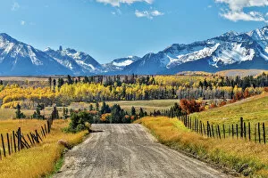 Images Dated 6th October 2017: Fence and dirt road leading to San Juan Mountain Range, Ridgway, Colorado, USA