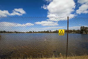 Images Dated 30th June 2010: A fenced off area and poison warning sign at the Robinson Dam in Randfontein