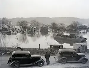 Ferry Takes Cars To Bridge Surface;Flood
