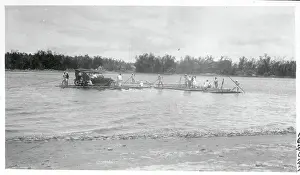 Ferry Worker Taking Car Across the Water