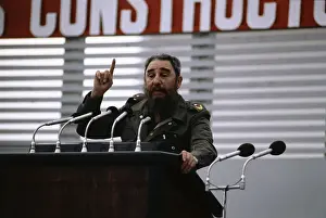 Fidel Castro Gesturing While Speaking at Microphones