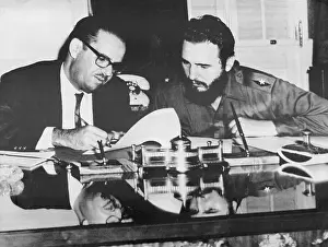 Fidel Castro and Osvaldo Dorticos Signing Decree