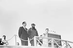 Fidel Castro and Osvaldo Dorticos Standing at Podium During Ceremony