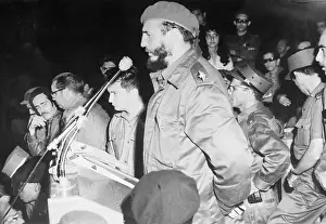 Fidel Castro Standing at Microphoned Podium