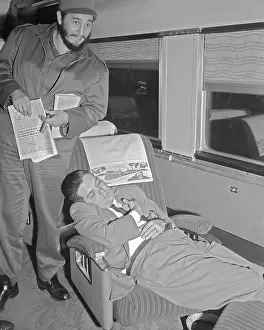 Fidel Castro Standing Over Train Seat of Reporter