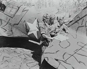 Fighter Pilots Examining Map