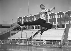 Ice Rink Prints: Figure Skater Dick Button Performing Jump