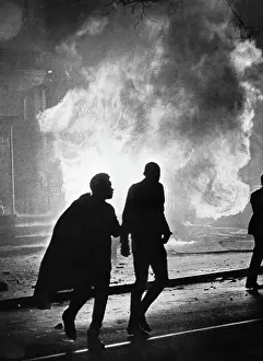 Looting Prints: Figures Silhouetted by Burning Building