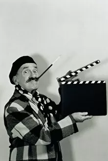 Images Dated 31st August 2005: FILM DIRECTOR HOLDING CLAPBOARD