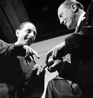 Prints of 28th February 1953: Actor Geoffrey Sumner being tutored in the pickpocket's art by former policeman Bob Fabian (right) for the Rank film Always A Bride' A Photographic Legacy: Film Tutor