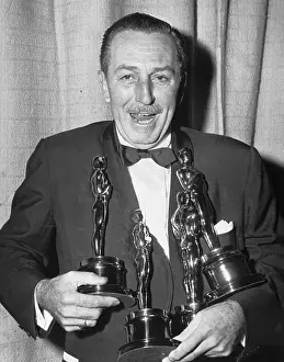 Filmmaker Walt Disney with Four Oscars