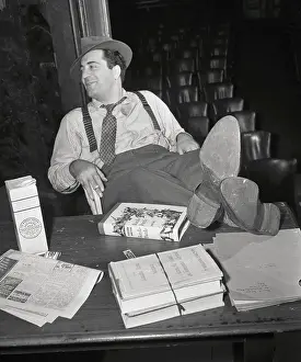 Filmmaker William Saroyan Reclining at His Desk