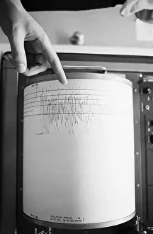 Earthquake Prints: Finger Pointing To Seismograph Reading
