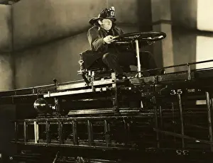 Steering Prints: Fireman W/Helmet Atop Fire Engine