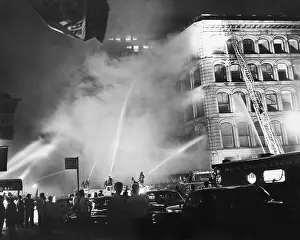 Fire Hose Prints: Firemen Attack Blaze with Hoses on Building