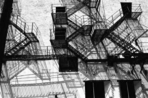 New York's Iconic Fire Escapes Collection: Firescape against building wall (B&W)