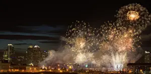 Fireworks in front of modern city skyline