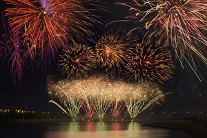 Fireworks reflecting on a lake