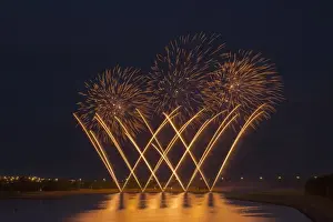 Fireworks reflecting on a lake