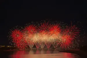 Fireworks reflecting on a lake