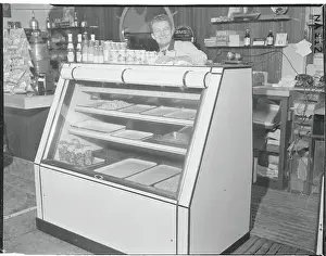 Despair Prints: Fish Market Owner Posing by Partially Empty Case