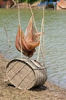 Fish trap made of bamboo and a fishing net on the Sangkae river, Battambang, Cambodia, Southeast Asia