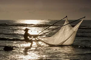 Images Dated 31st July 2016: One fisherman on the beach, dawn, Vietnam