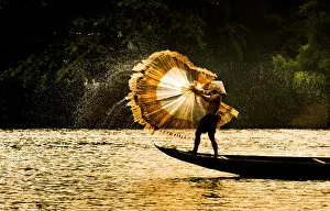 Images Dated 2nd May 2013: Fisherman catch fish in the river in Hue, Vietnam