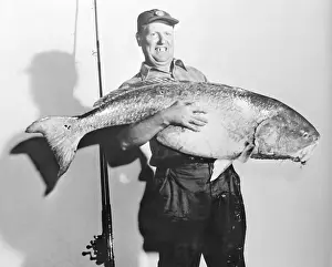 Heavy Prints: Fisherman Posing With Huge Fish
