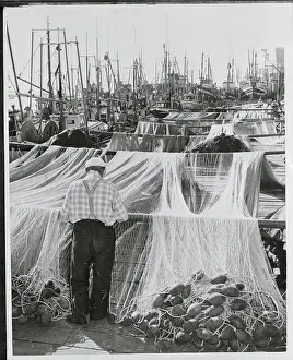 Fisherman Repairing a Net