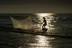 Images Dated 31st July 2016: Fisherman with v-shape net in beach
