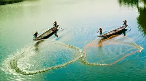 Images Dated 2nd May 2014: Fishermen catch fish in the river in Hue, Vietnam