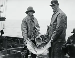 Fishermen Holding Fish