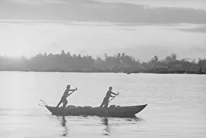 Fishermen Paddling Boat