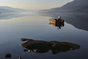 Fishing boat on Loch Arkaig in the early morning, Fort William, Highlands, Scotland, United Kingdom